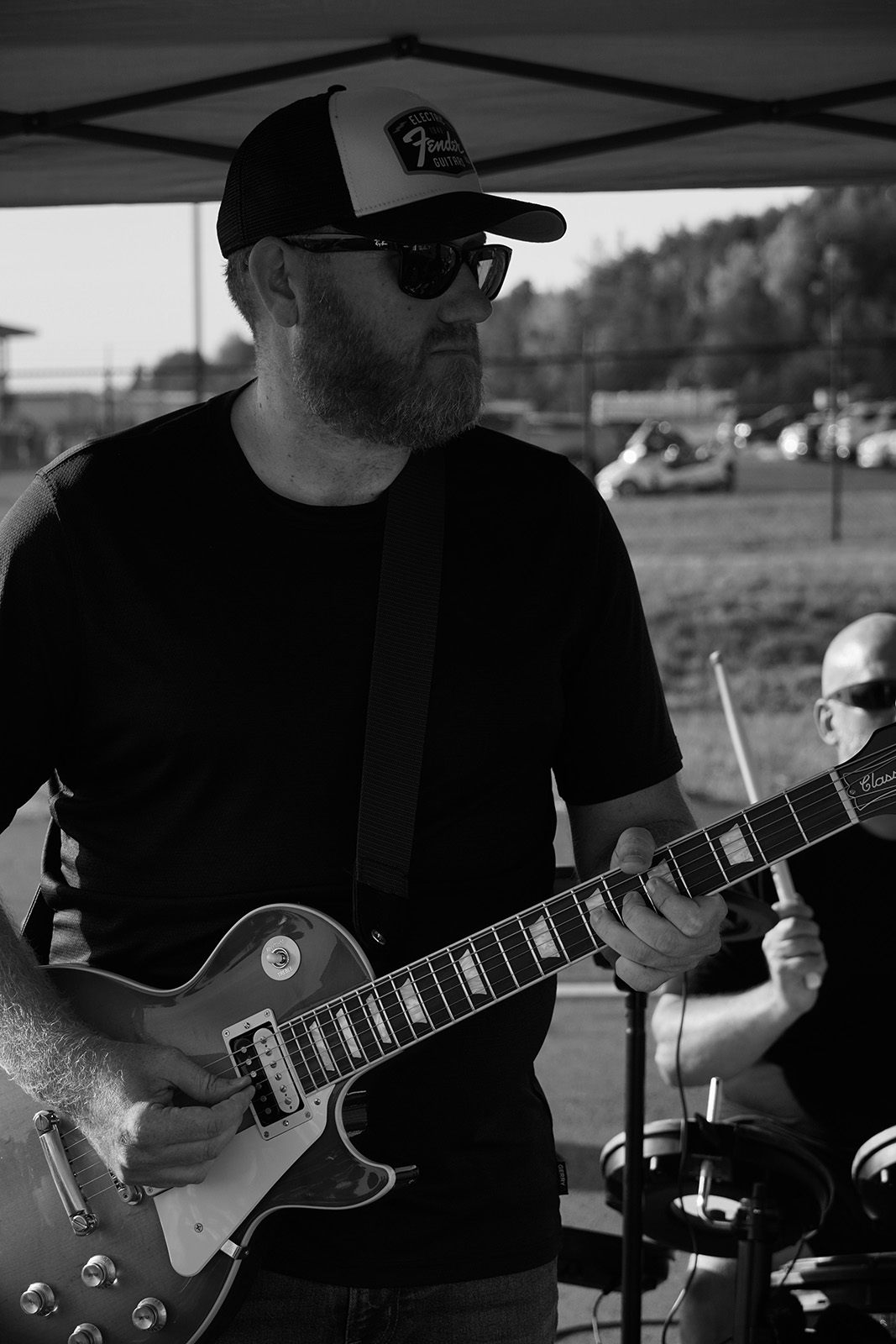 Jay playing guitar with his band